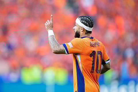 Memphis Depay celebrates scoring a goal against Austria